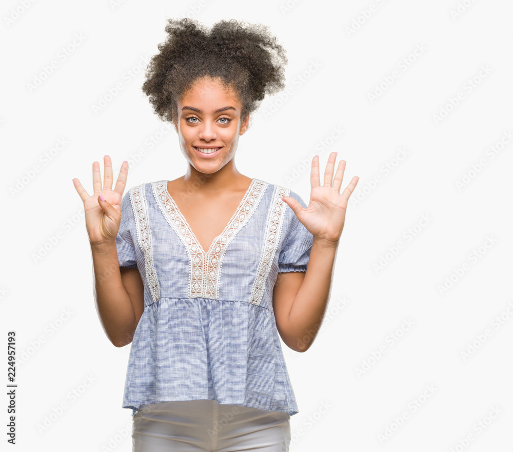 Young afro american woman over isolated background showing and pointing up with fingers number nine while smiling confident and happy. Young afro american woman over isolated background showing and pointing up with fingers number nine while smiling confident and happy.