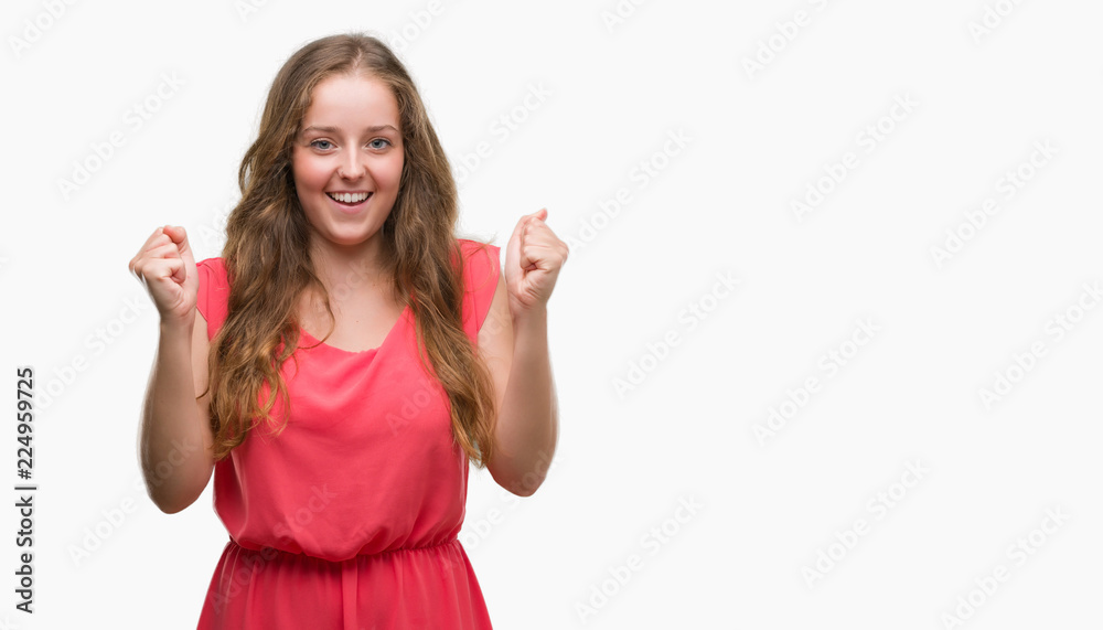 Young blonde woman wearing pink dress screaming proud and celebrating victory and success very excited, cheering emotion Young blonde woman wearing pink dress screaming proud and celebrating victory and success very excited, cheering emotion