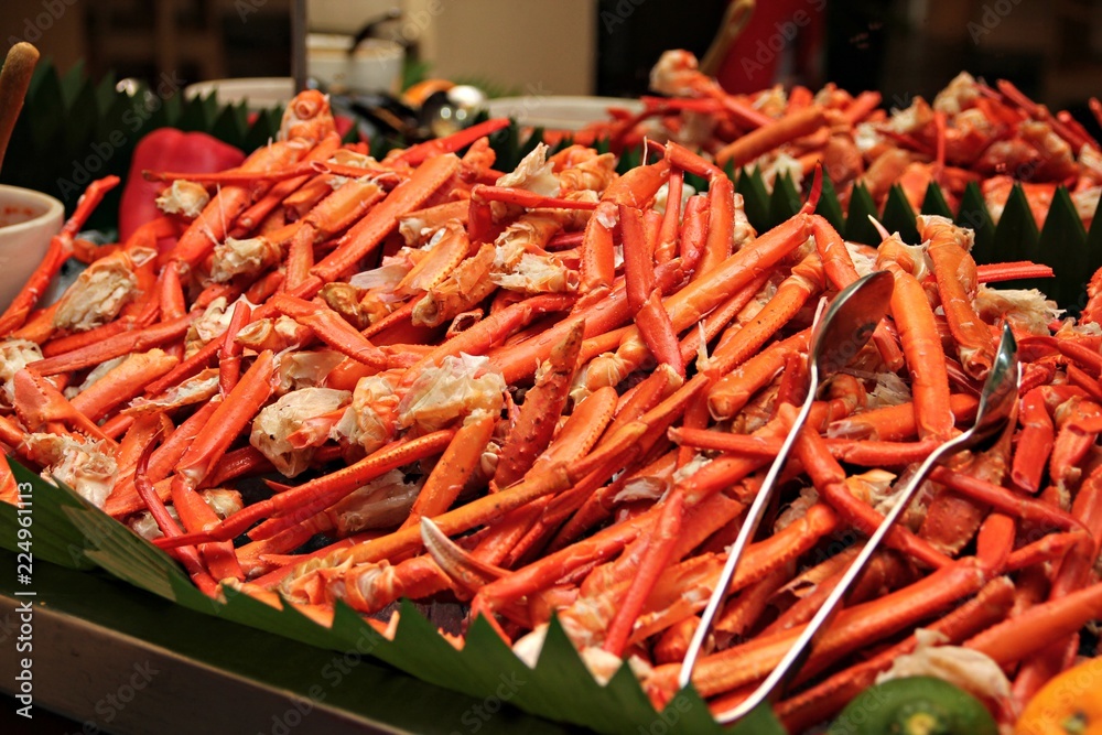 Cooked coconut crab legs served in a buffet tray Cooked coconut crab legs served in a buffet tray