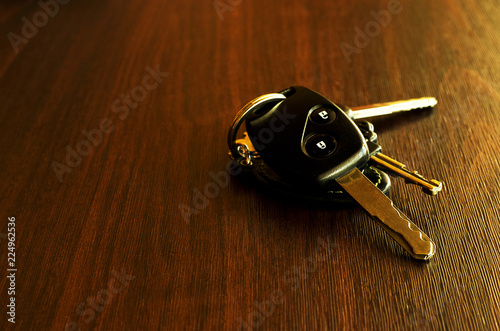 Still life of Keys car on wooden table background
