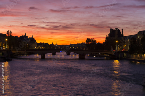 Spectacular crimson sunset over the Seine River in Paris