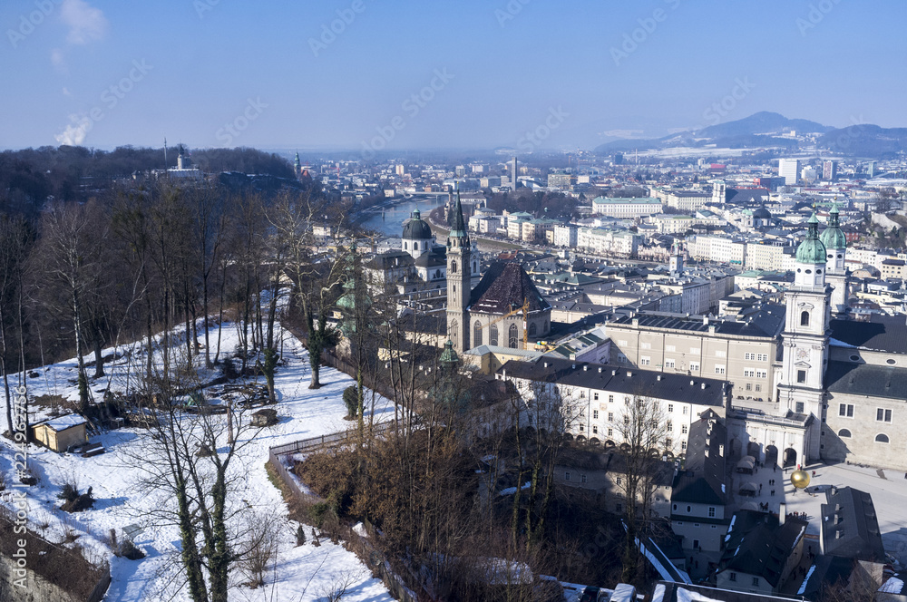 View over Salzburg with snow covered park and Cathedral in foreground