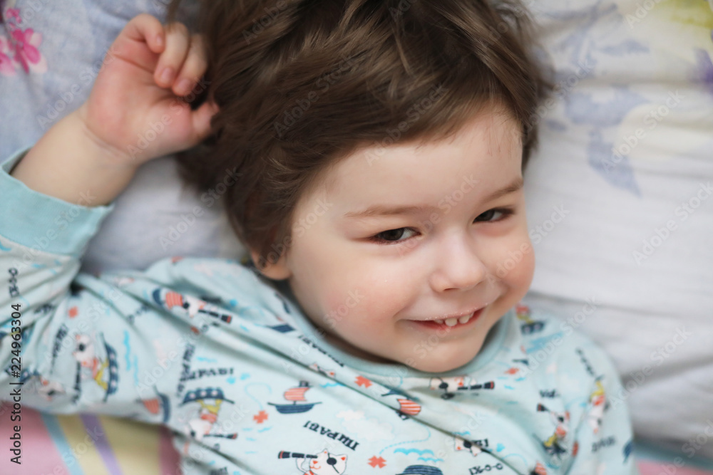 Portrait of a young child lying on a pillow Portrait of a young child lying on a pillow