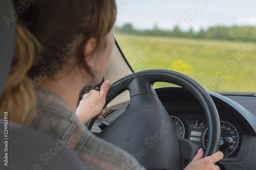 Young woman driving car photo