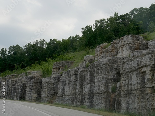 Stone walls border the cliff lines along the way just before reaching Hollister in Missouri.