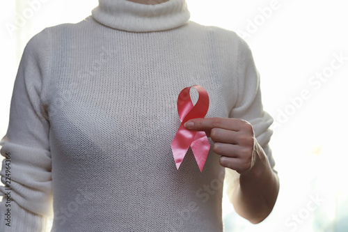 Wallpaper Mural The red ribbon of the girl. The girl is holding a red ribbon. He Torontodigital.ca