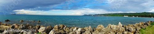 A panoramic view of the Smiling Cove Marina with distant views of Managaha Island on the left, and Saipan seaport on the right side