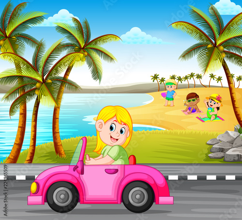 the woman drives the pink car on the street with the beautiful beach background 
