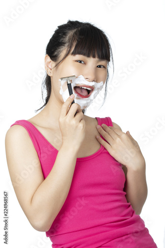 Chinese woman shaving isolated on a white background