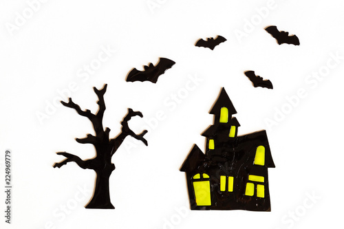 Top view of Halloween crafts, house, bat, tree on white background with copy space for text. halloween concept. Flat lay