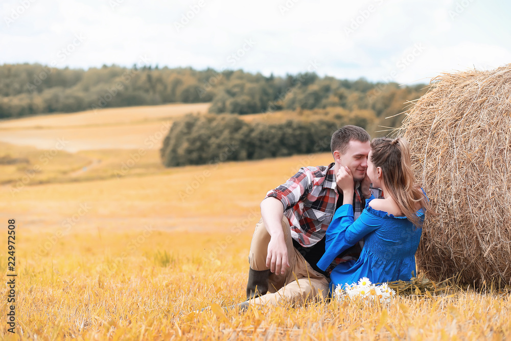Couple on a walk in the country fields Couple on a walk in the country fields
