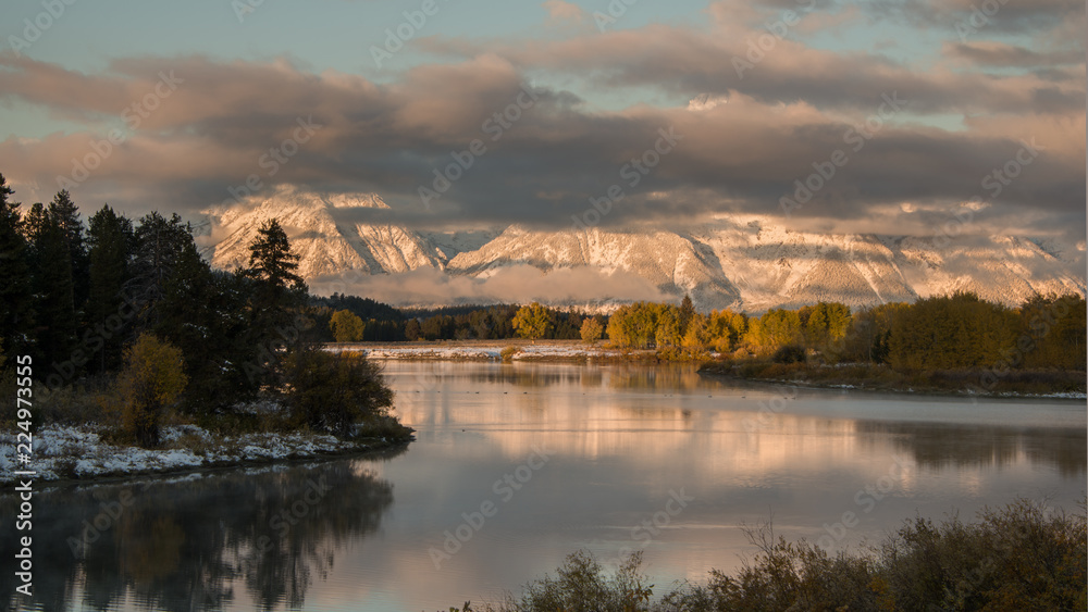 Autumn Sunrise view from Oxbow Bend, Snake River with Mount Moran's reflection at Grand Teton National Park, USA