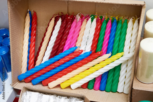 Foto Colorful festive candles on market for Christmas
