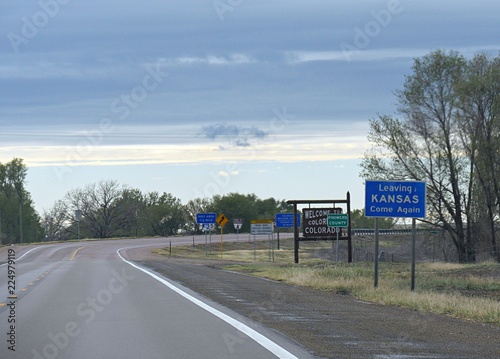 Road signs at the border of Kansas and Colorado in Prowers County