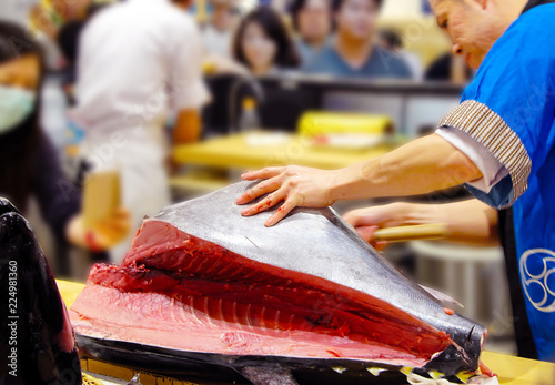 The chef cutting tuna in restaurant