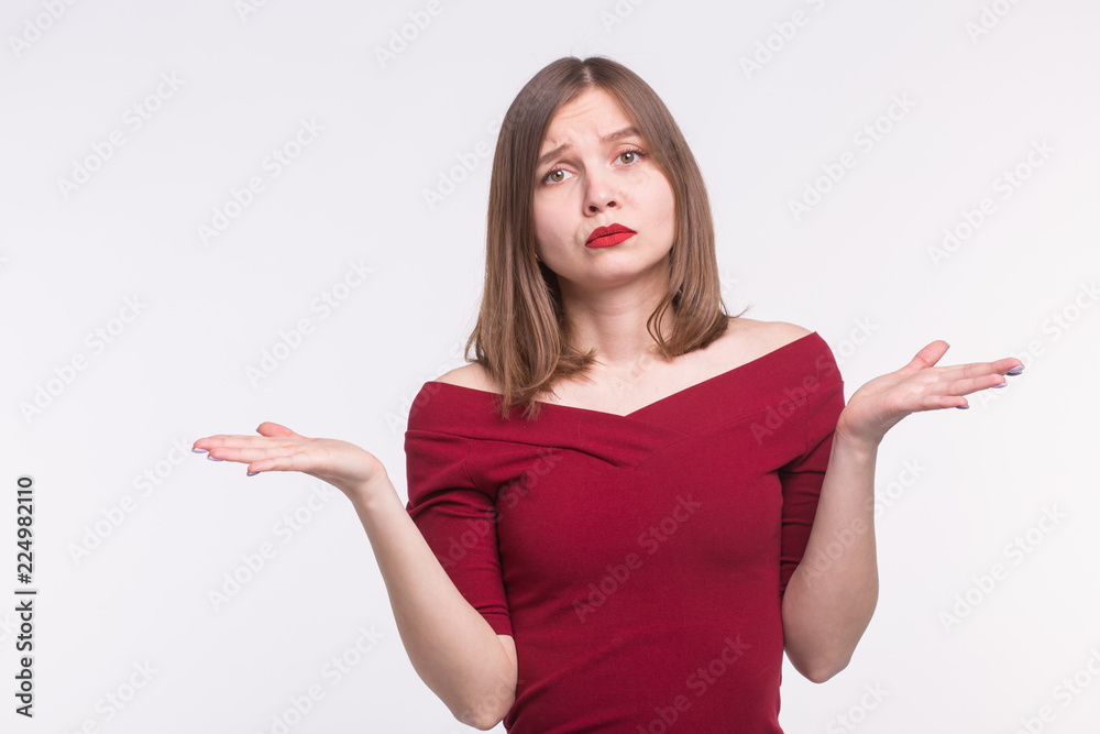 Feelings, emotions and people concept - Sad young woman in red top draw her hands Feelings, emotions and people concept - Sad young woman in red top draw her hands