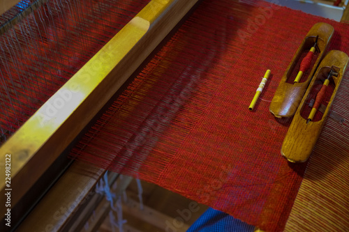 On the machine of weaving work. photo