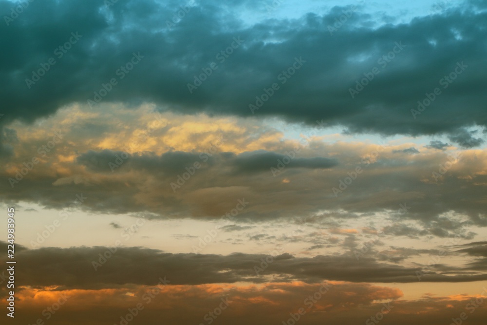 lovely vivid sun colored clouds in the sky for using in design as background.