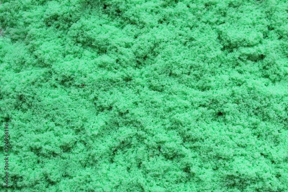 Obraz premium Texture loose sand green color background texture
