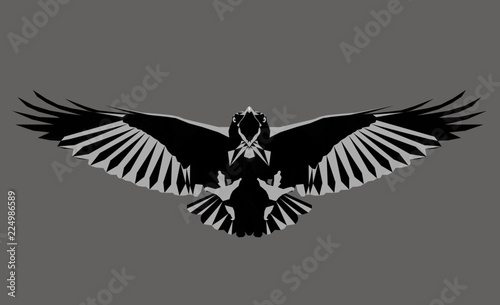 Monochrome crow. Low poly triangular  raven in flight on grey background, symmetrical vector illustration EPS 8 isolated. Polygonal style trendy modern logo design. Suitable for printing on a t-shirt.