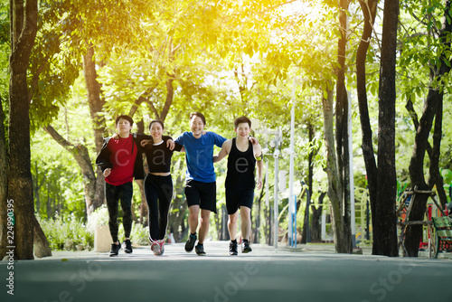 Group asia join teenagers are running in the morning with fresh air in the park. Running a good exercise helps the body system burn excess fat. Give a good respiratory system. make you feel relaxed. © Rapeepat