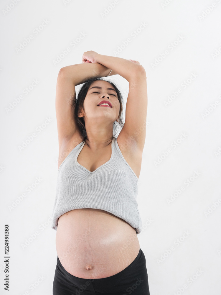 Asian pregnant woman exercise at home, lifestyle concept. Asian pregnant woman exercise at home, lifestyle concept.