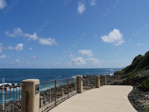 Paved walkway with railings at the back walkway at Fort El Morro in Old San Juan, Puerto Rico. © raksyBH