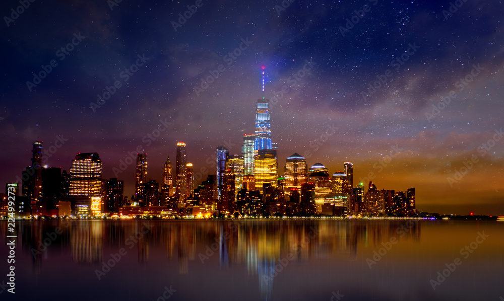 Naklejka premium Manhattan skyline with reflections at night, New York City.