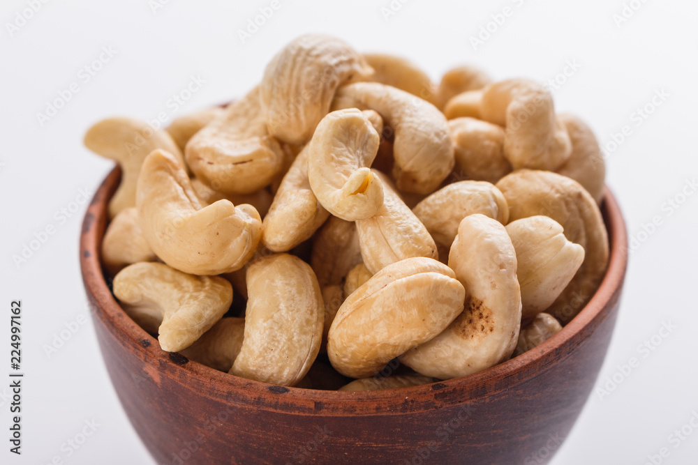 cashew nuts on a white acrylic background cashew nuts on a white acrylic background