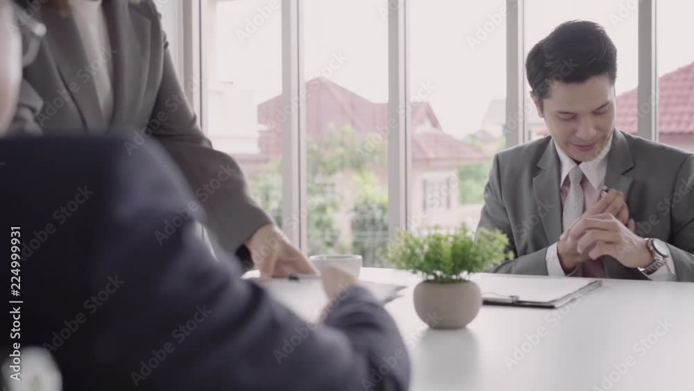 Slow motion - Beautiful woman secretary giving document to businessman to signing a contract, recruitment and agreement concept. Businessman making a deal. Slow motion - Beautiful woman secretary giving document to businessman to signing a contract, recruitment and agreement concept. Businessman making a deal.