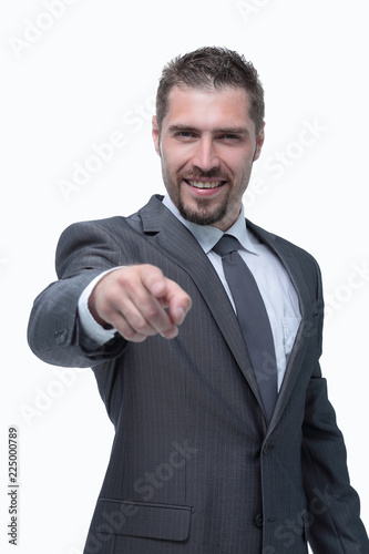 in full growth.closeup.confident businessman pointing forward .