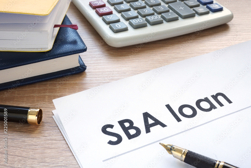 SBA loan form on an office table. SBA loan form on an office table.