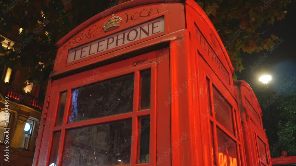 Red phone booths. London at night. Red phone booths. London at night.
