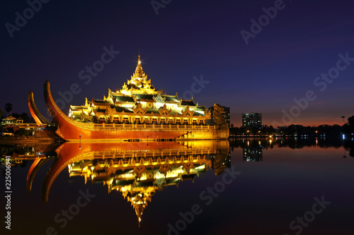 Beautiful night of water reflection with Karaweik Palace in Kandawgyi Royal Lake at Yangon, Myanmar