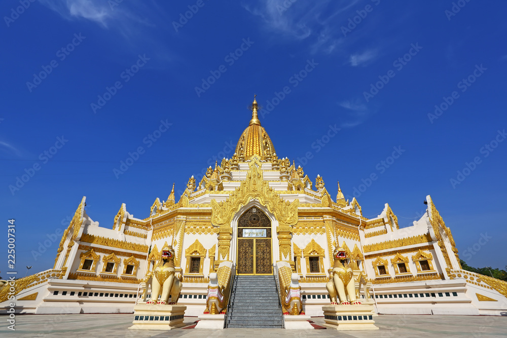 Golden pagoda, Swe Taw Myat, Buddha Tooth Relic Pagoda at Yangon, Myanmar with blue sky background