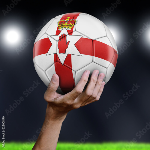 Man holding Soccer ball with Northern Ireland flag