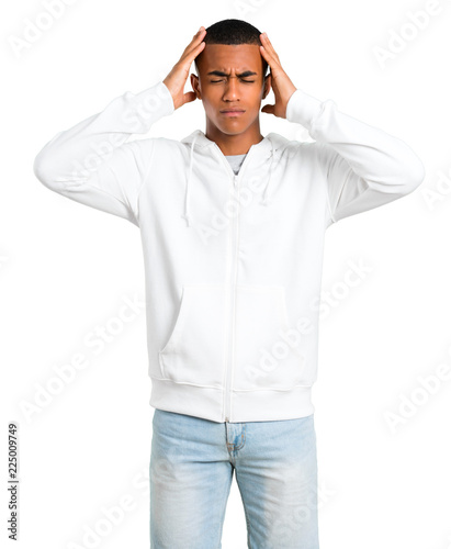 Dark-skinned young man with white sweatshirt unhappy and frustrated with something. Negative facial expression on isolated white background