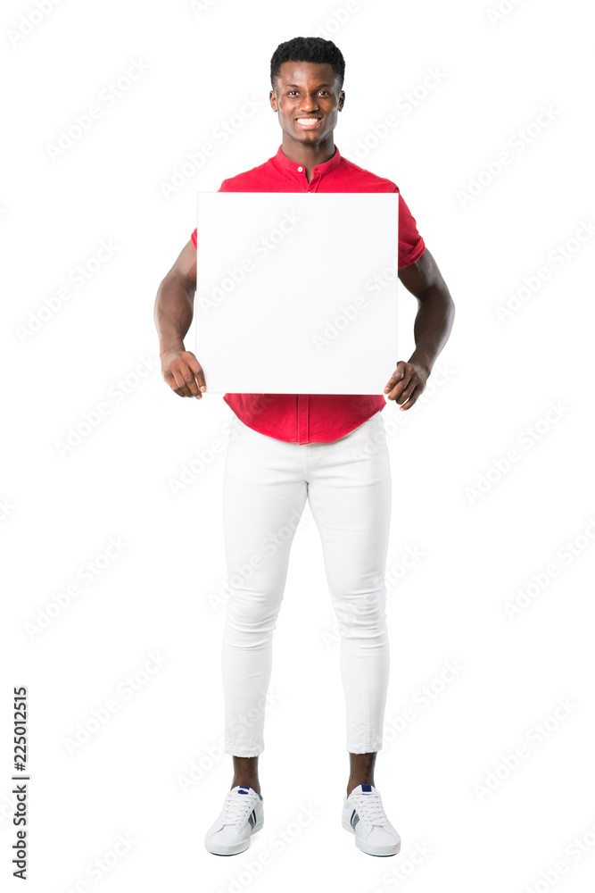 Full body of Young african american man holding an empty white placard for insert a concept on white background Full body of Young african american man holding an empty white placard for insert a concept on white background
