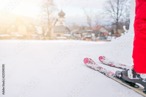 Little girl preparing to ski downhill photo