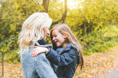 Photography Mother and daughter playing and looking each other at park