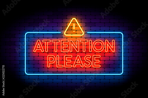 Attention please neon sign on the wall with triangle icon.