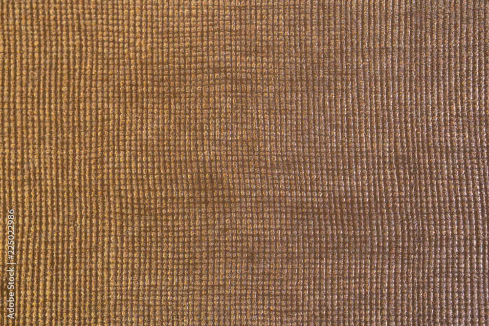 Shiny golden textured fabric with square pattern macro shot for backdrop Shiny golden textured fabric with square pattern macro shot for backdrop
