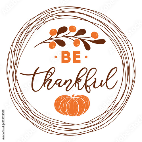Be thankful text decorated fall branch with berry pumpkin into circle wreath orange brown autumn colors Thanksgiving day