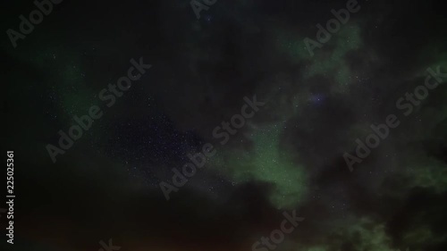 Wallpaper Mural Aurora borealis and stars shining though breaks in the clouds, Iceland time lapse.mov Torontodigital.ca