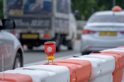 LED light bulb attached to street barriers use for fraffic precaution signal in the night on the road of South Korea. photo