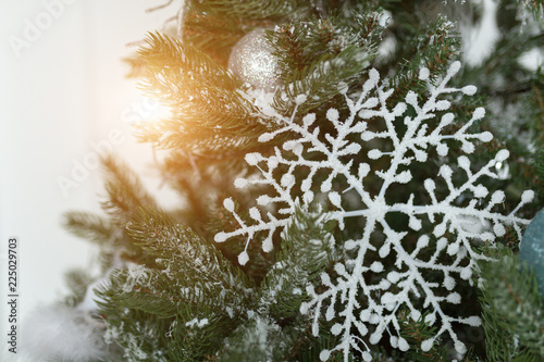 White snowflake at the christmas tree Happy new yewr concept photo