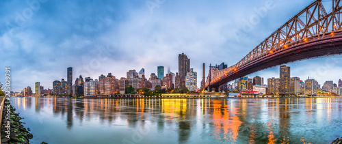 New York, New York, USA skyline of Manhattan from across the East River with Queensboro Bridge at dusk. © SeanPavonePhoto