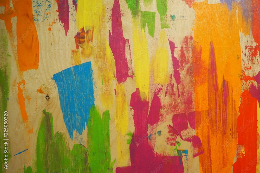 Wood texture painted with blue, red, green, purple paint. Blue painted wood. Painted wood background. Colorful wood wall