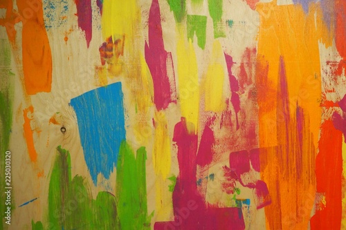 Wood texture painted with blue, red, green, purple paint. Blue painted wood. Painted wood background. Colorful wood wall
