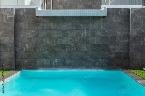 Swimming pool  with a waterfall.